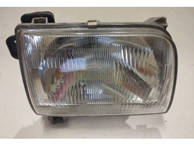 Nissan D22 - Farol principal direito H4 (NISSAN - KOITO)